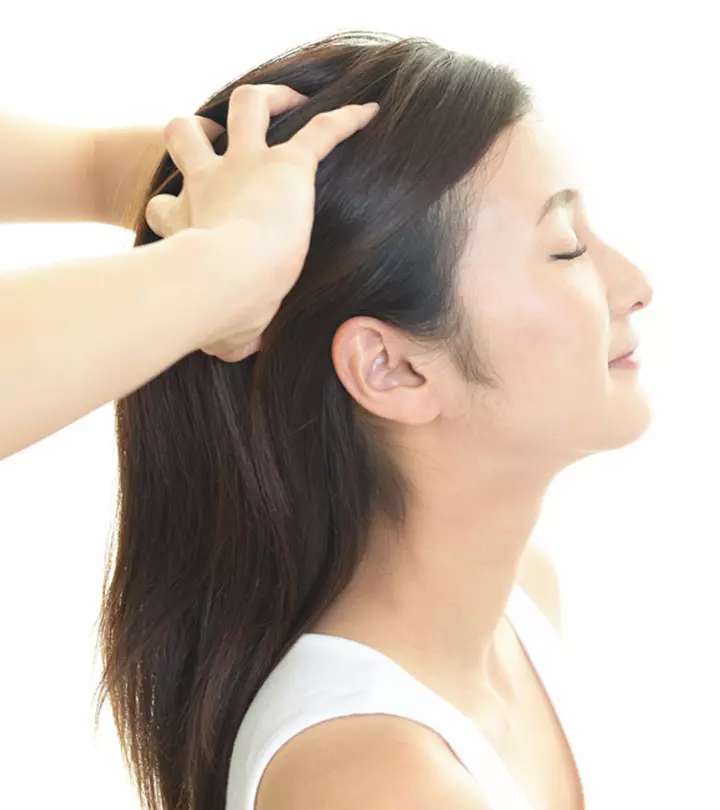 woman taking scalp massage for hair growth
