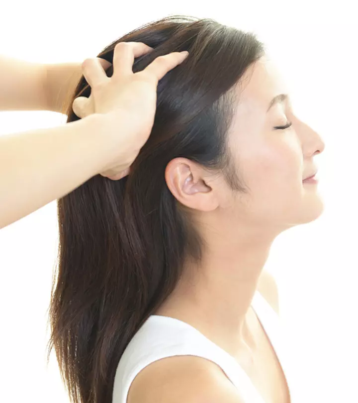 A girl is getting a head massage