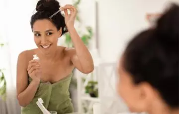 Woman uses eucalyptus oil for hair growth.
