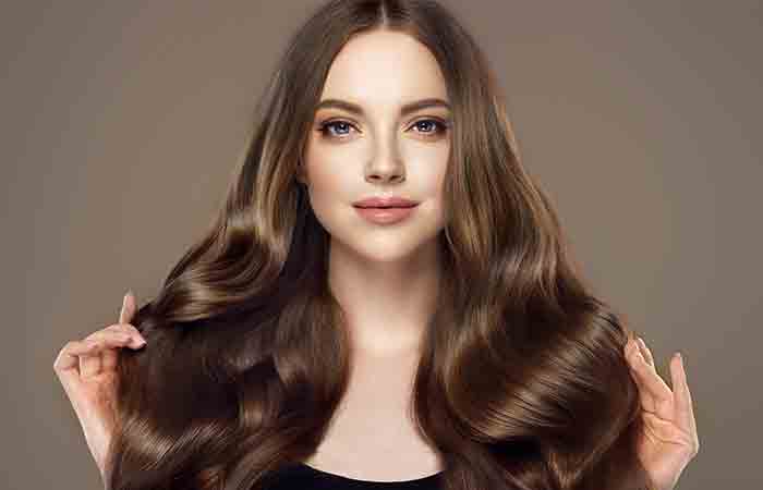 Woman having healthy and shiny hair after using coffee for hair