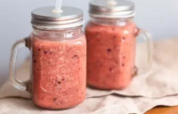 Vitamin C smoothie with orange, kiwi, and watermelon for boosting hair growth