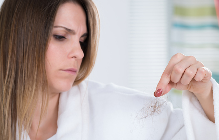 Woman wondering if her hair loss is due to a thyroid issue