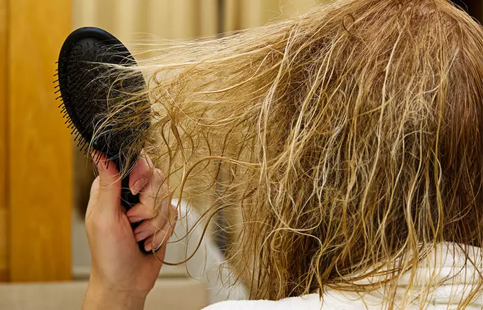 Woman exepriencing damaged hair due to excessive exposure to sun