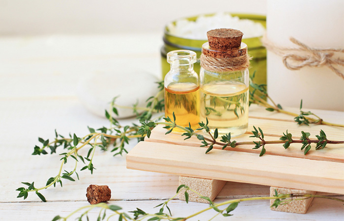 Bottles of olive oil and tea tree oil for head lice