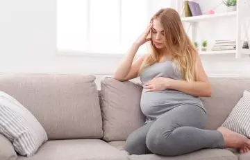 Pregnant woman thinking about laser hair removal side effects