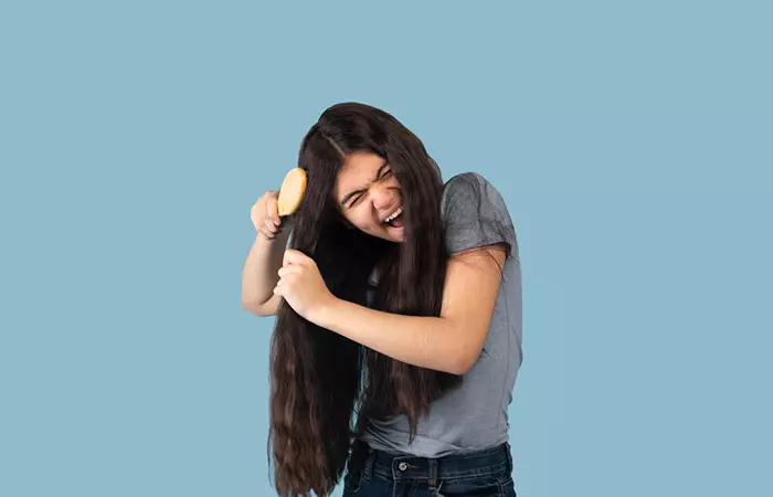 Woman with rough hair due to heat styling tools