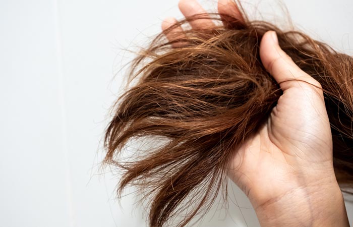 Woman with damaged hair due to frequent shampooing