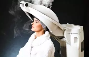 Woman getting a hair steaming treatment
