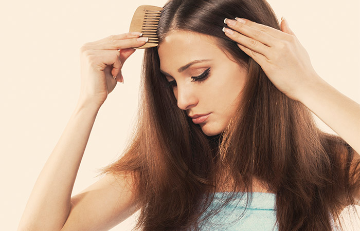Woman combing hair to style it better