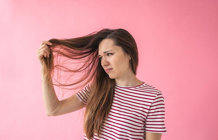 Woman with dry hair may benefit from neem oil