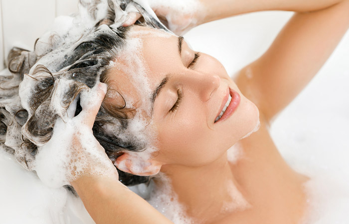 Woman using anti-dandruff shampoo