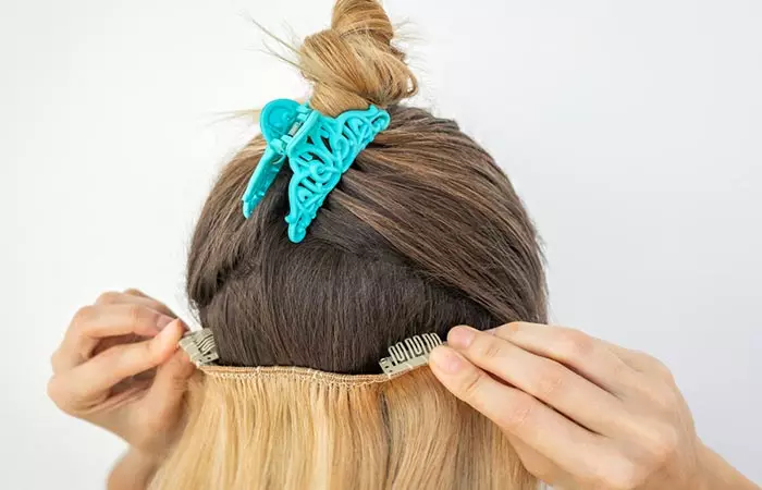 Woman removing hair accessories and extensions 