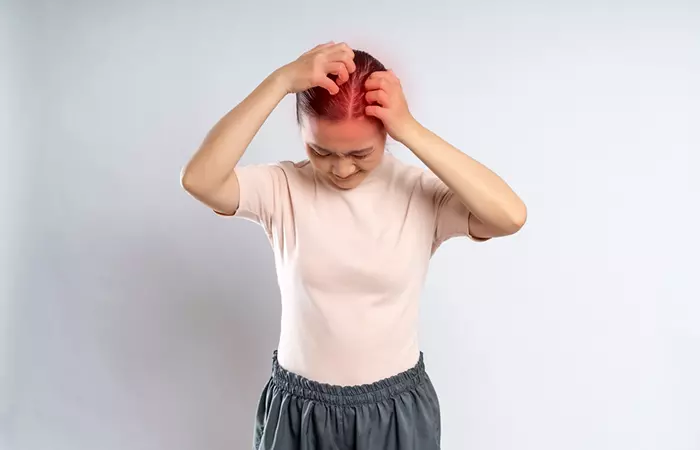 Woman experiencing scalp irritation due to hair conditioner of higher pH level