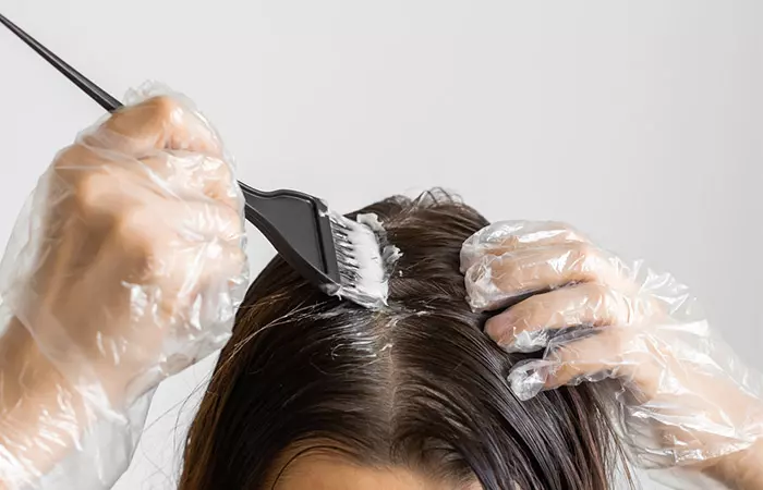 Woman dyeing her own hair