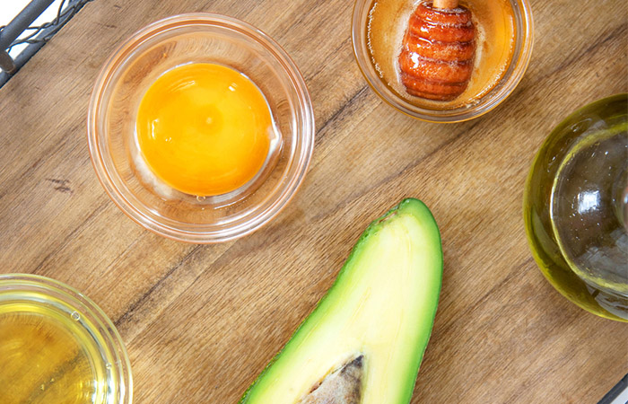 Avocado, egg, honey, and olive oil for restorative hair mask