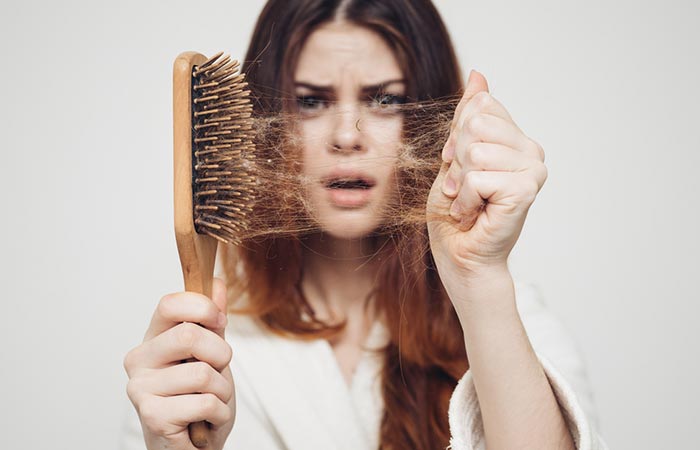 Woman experiencing hair loss due to vitamin B12 deficiency