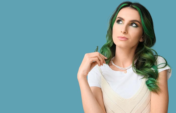 Woman with unusual green hair wondering about something