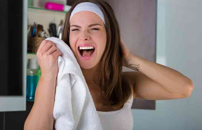 Woman experiencing friction due to a tight hair band