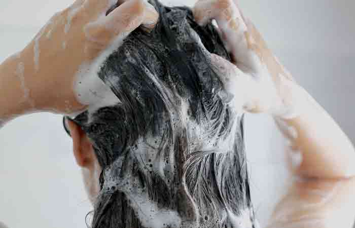 Woman shampooing her hair