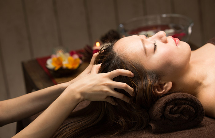 A girl getting a relzing head massage