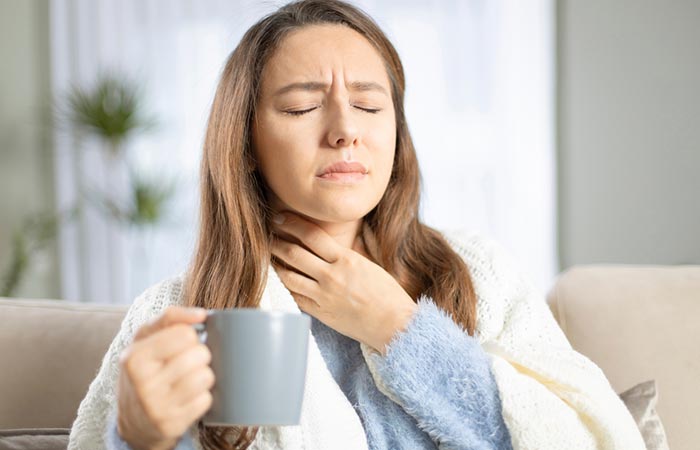 Woman with a sore throat due to vitamin B2 deficiency