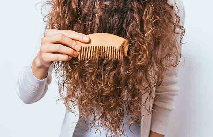 Woman combing her 3A type hair