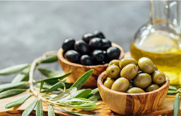 Green and black olives on a table