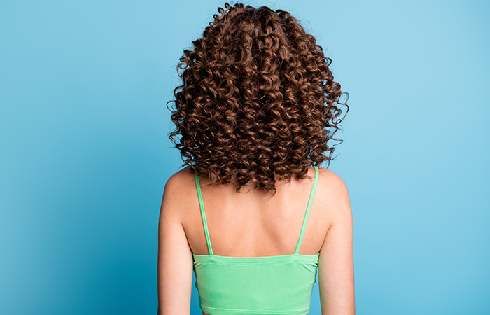 Woman with spiral perm