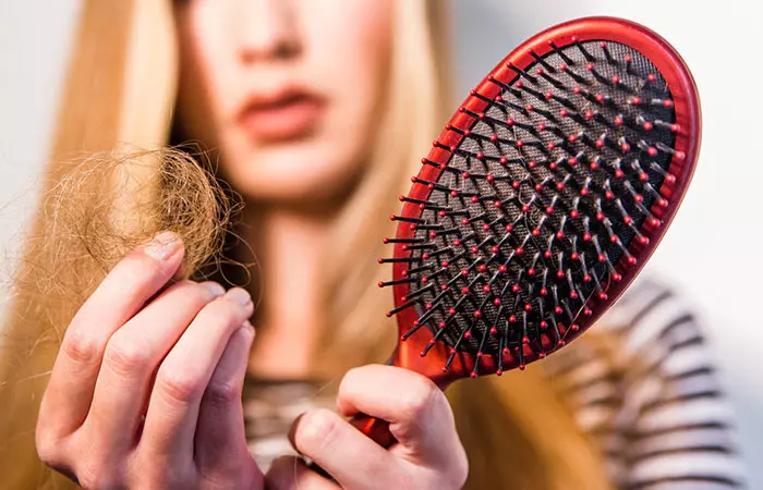 Woman experiencing hair fall and hair breakage