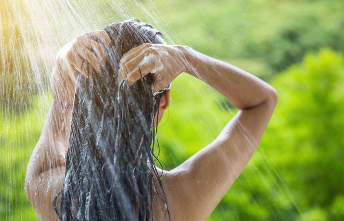 Woman using anti- dandruff shampoo