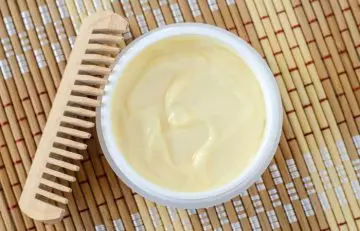 Applying mayonnaise on hair
