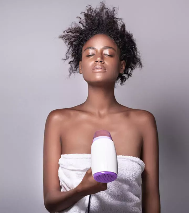 woman doing blow drying curly hair