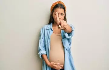 Pregnant woman gesturing no