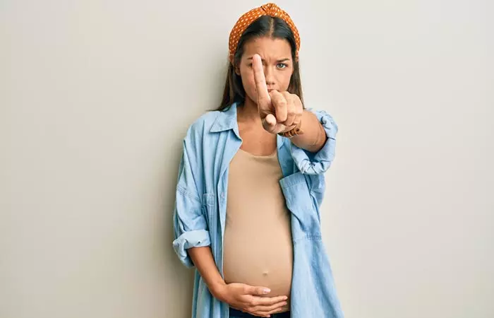 Pregnant woman gesturing no