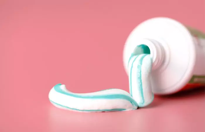 Toothpaste spilling out of its tube