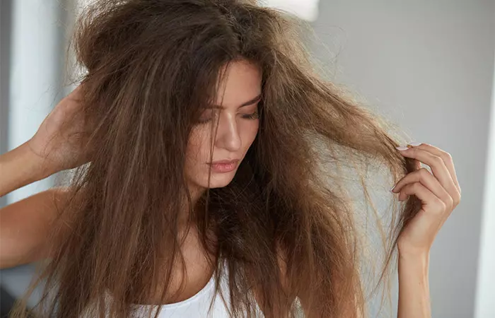 Woman with dry hair may benefit from mango butter