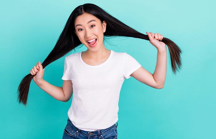 Woman happy with her hair growth after using horsetail
