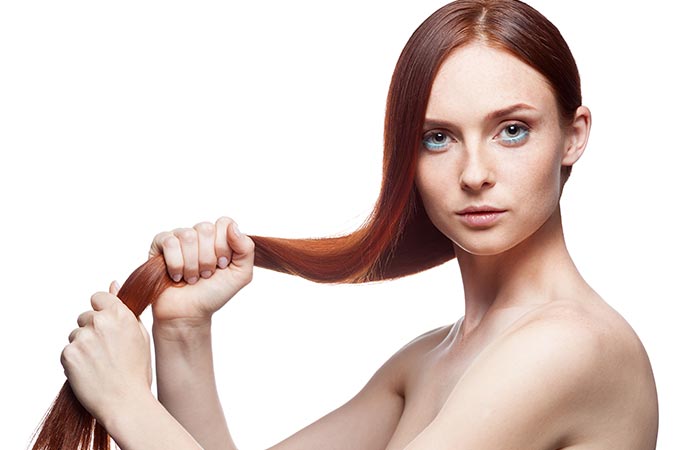Woman holding her strong and healthy hair