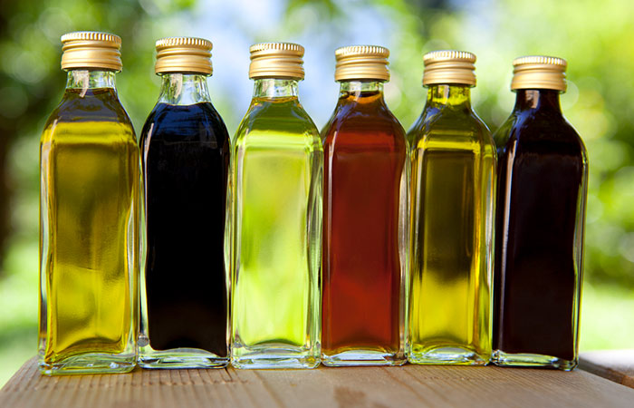 Bottles of apple cider vinegar and essential oils