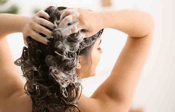 Woman using castile soap shampoo for hair wash