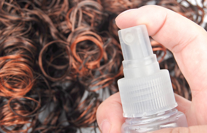 Close up of hair spray for dyed hair in the background