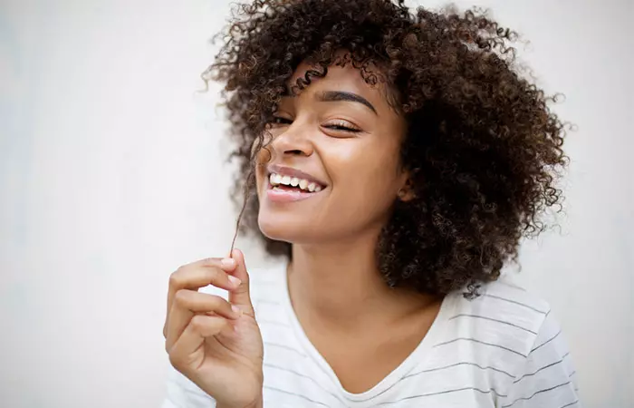 Woman with natural, voluminous, and strong hair