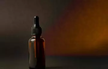Jamaican black castor oil in a glass bottle