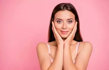 Woman feeling happy and good about her skin