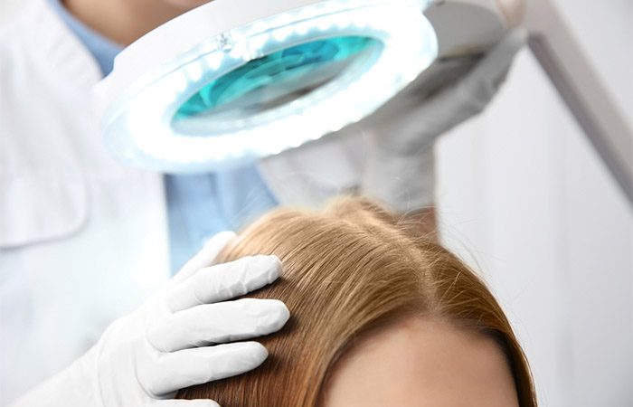 A medical expert examining the hair loss condition of the patient