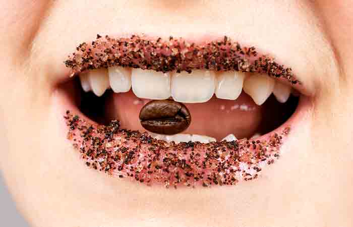 Woman with coffee and sugar lip scrub on her lips