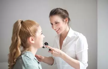 Woman consulting a dermatologist