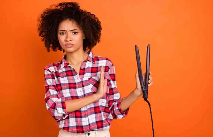 Woman denies using a straightener