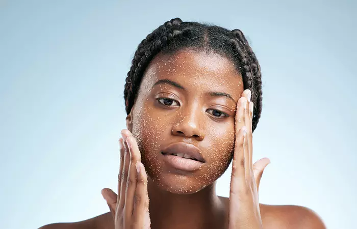  Woman with gentle exfoliating scrub on face