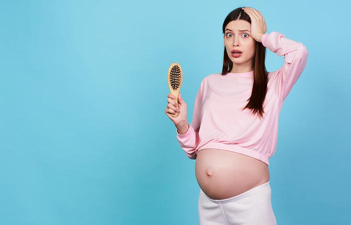 Woman experiencing hair thinning during pregnancy